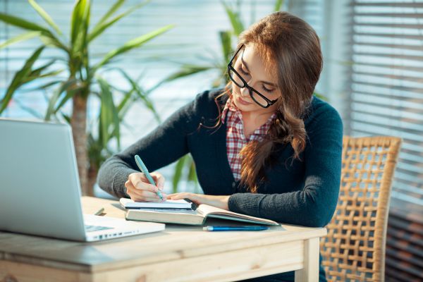 Beautiful student girl n glasses studying